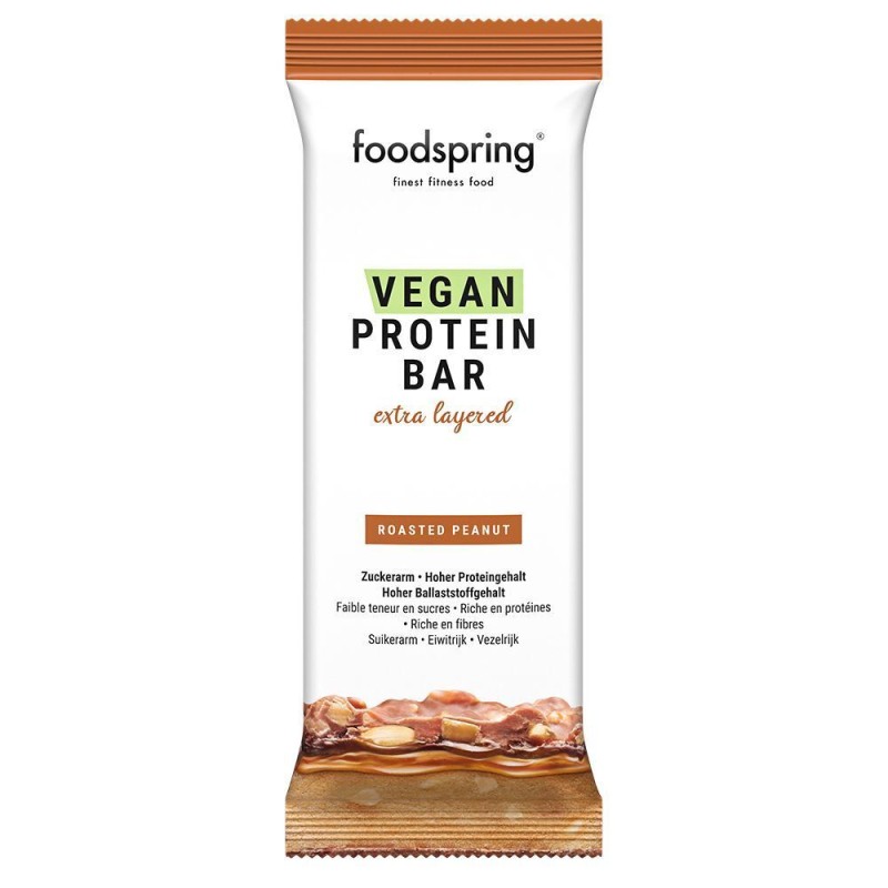 Dettaglio del packaging di Foodspring Barretta Proteica Vegana Multistrato Gusto Arachidi 1 Pezzo Dettaglio del packaging di Foodspring Barretta Proteica Vegana Multistrato Gusto Arachidi 1 Pezzo